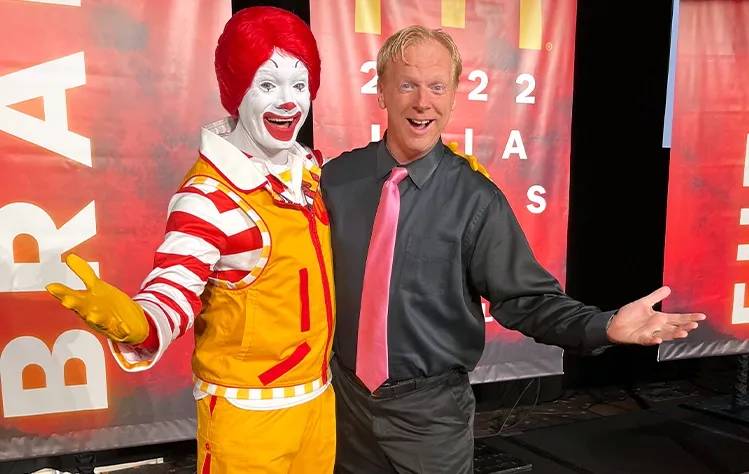Andy Masters posing with Ronald McDonald