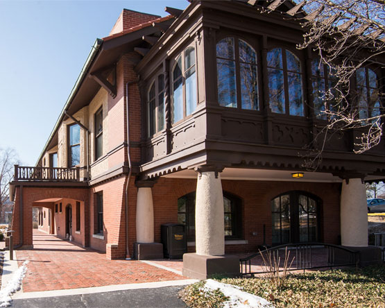 The Sam Priest Building, a large brick and stucco building located on the Webster Groves campus.